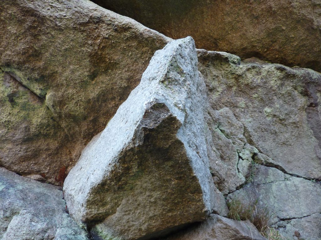 Picture of a rock face with an indentation at the centre